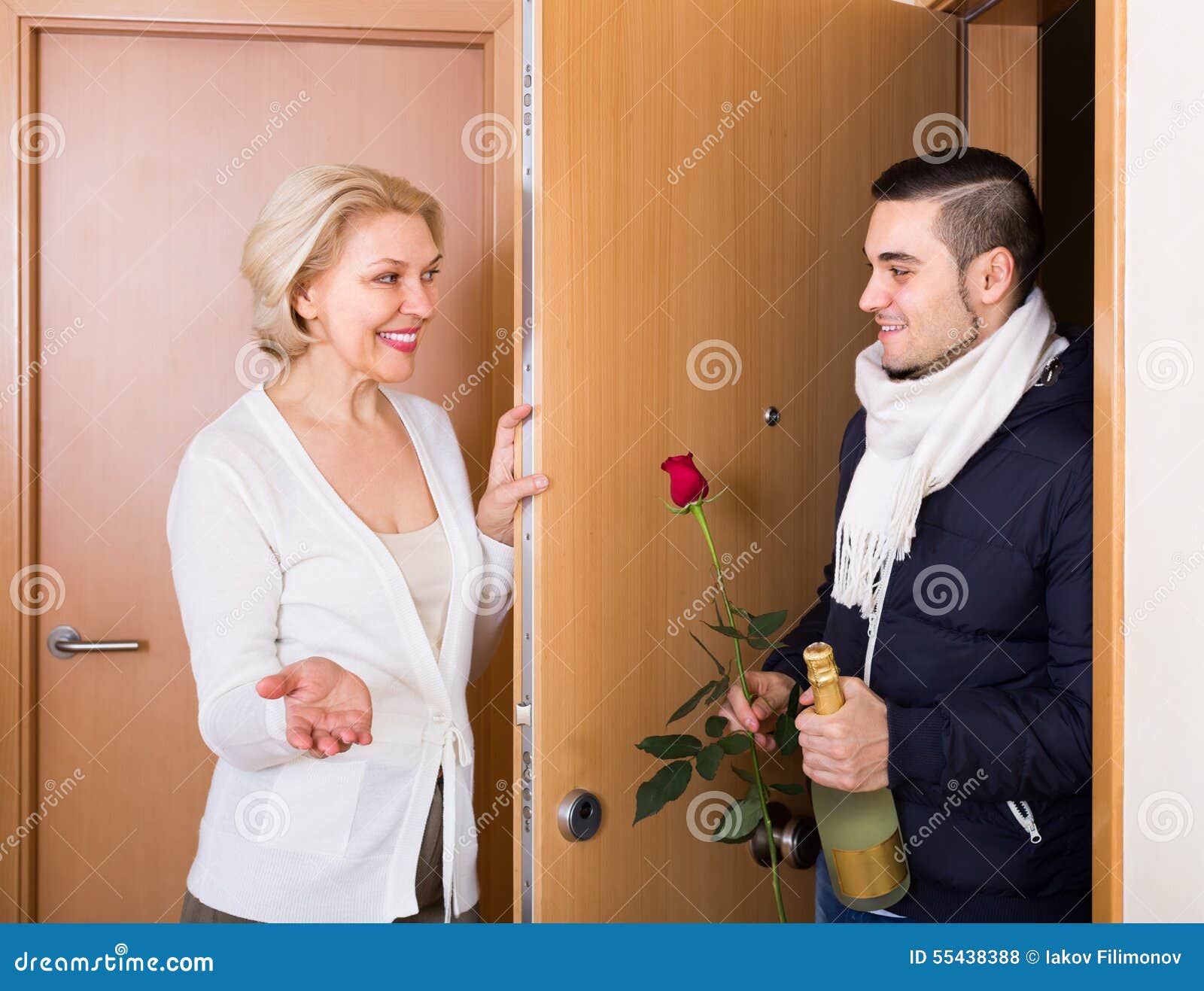 Mature Woman And Young Guy At Doorway Stock Phot