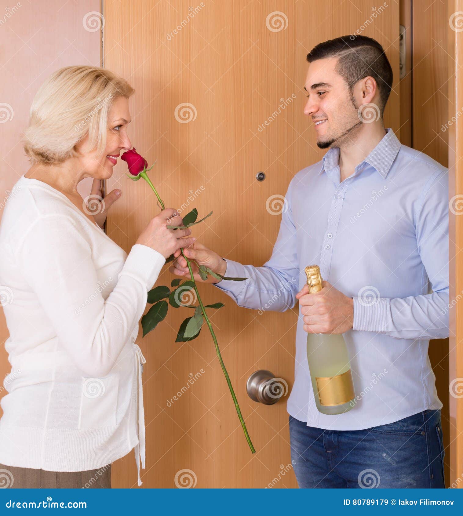 Mature Woman And Young Guy At Doorway S