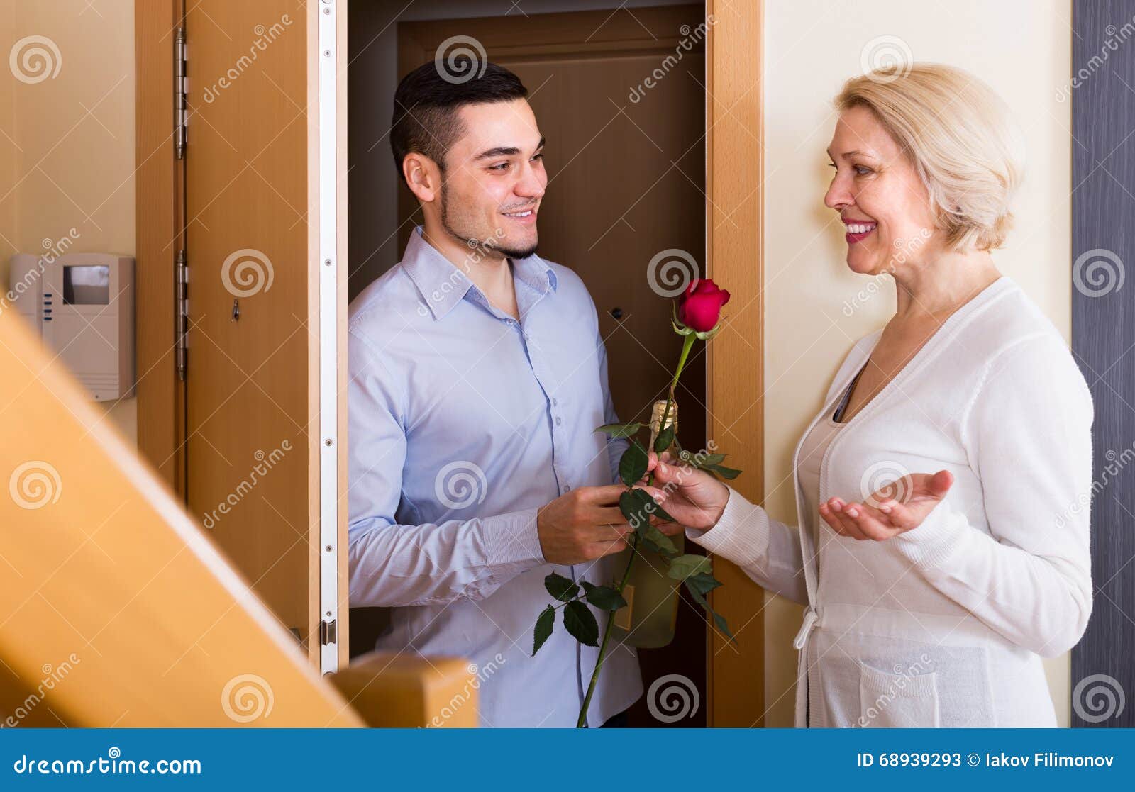 Mature Woman And Young Guy At Doorway Stock Image Image Of