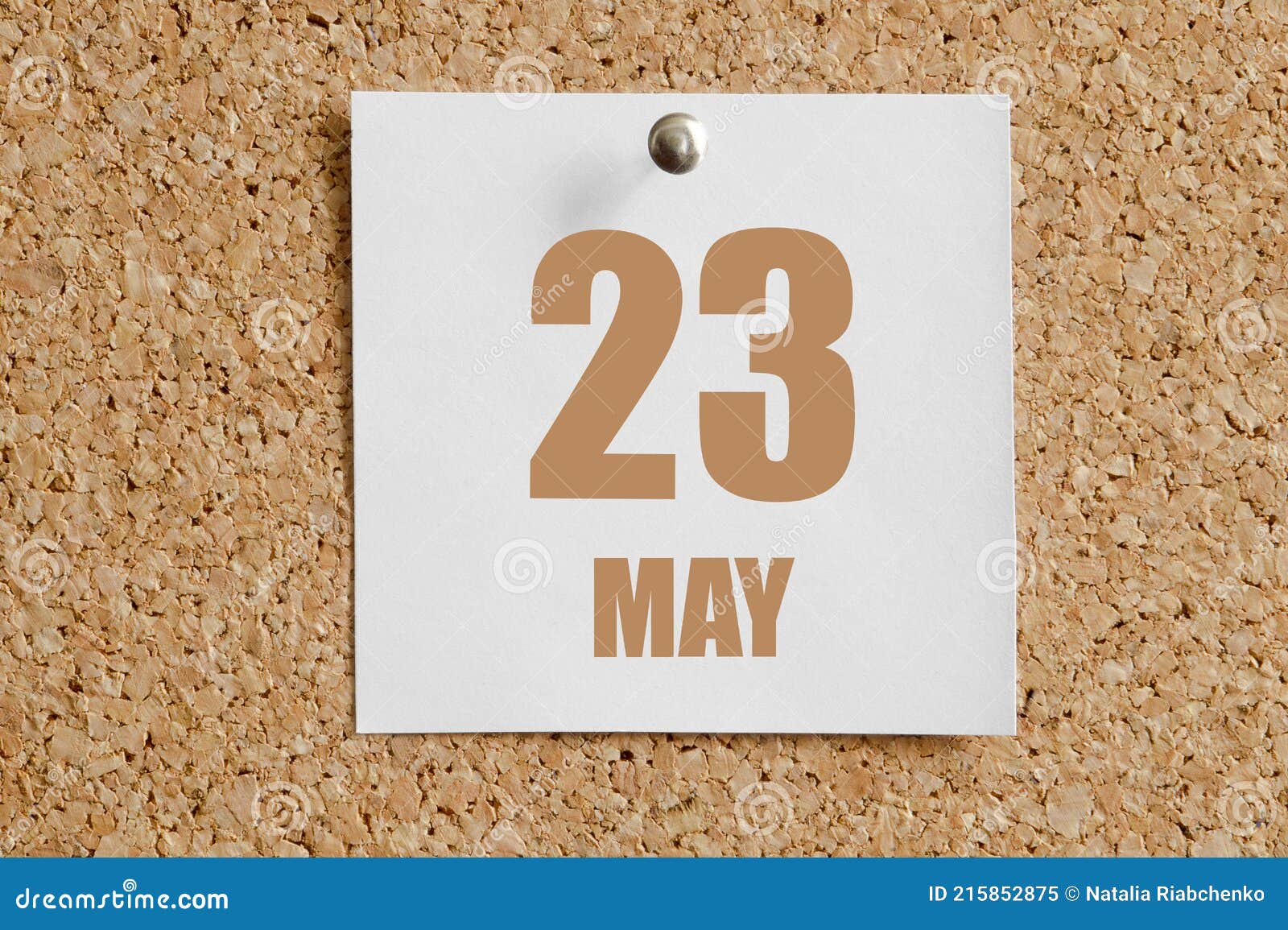 may 23. 23th day of the month, calendar date. white calendar sheet attached to brown cork board.spring month, day of the year