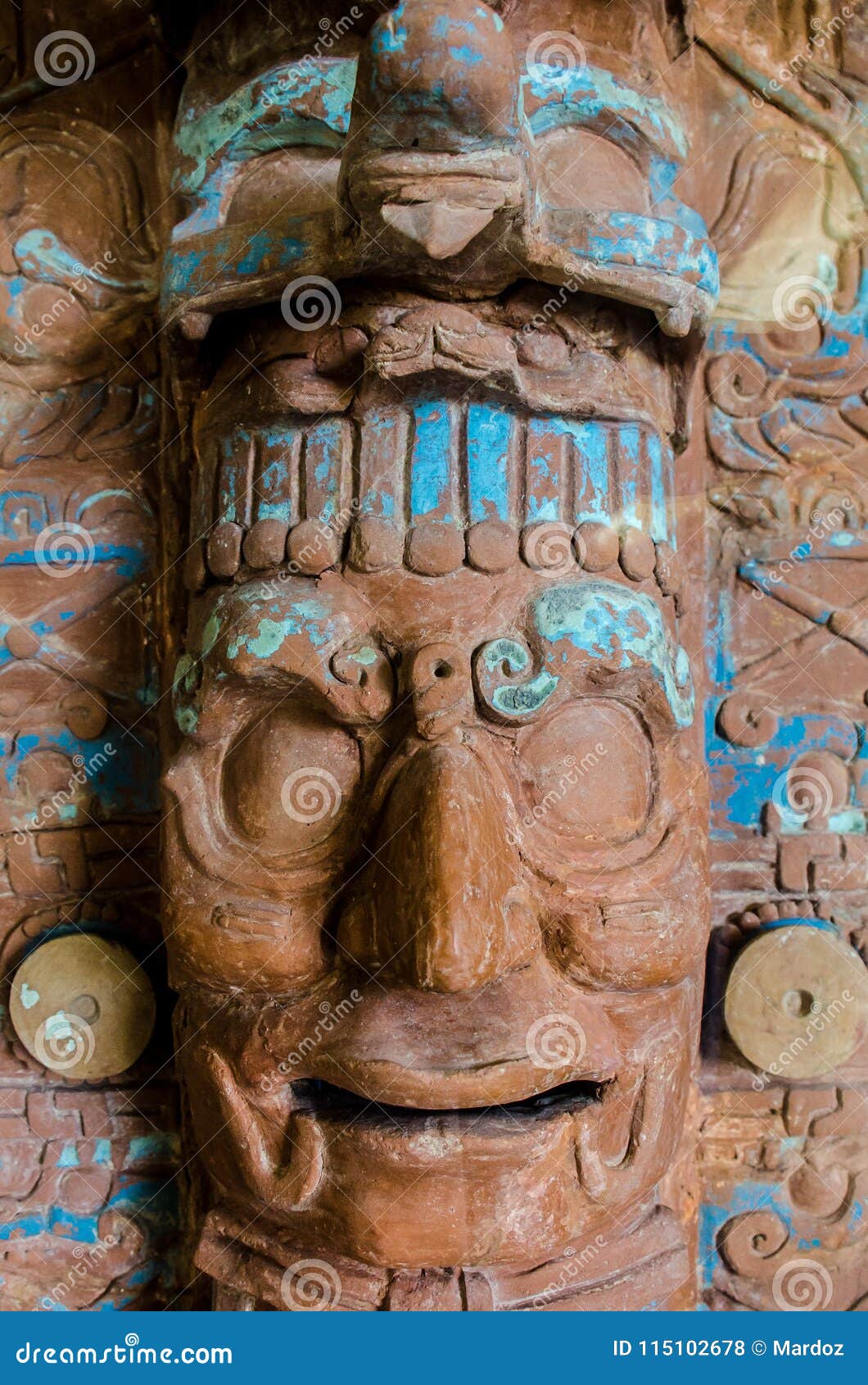 ancient mayan face of clay at a museum