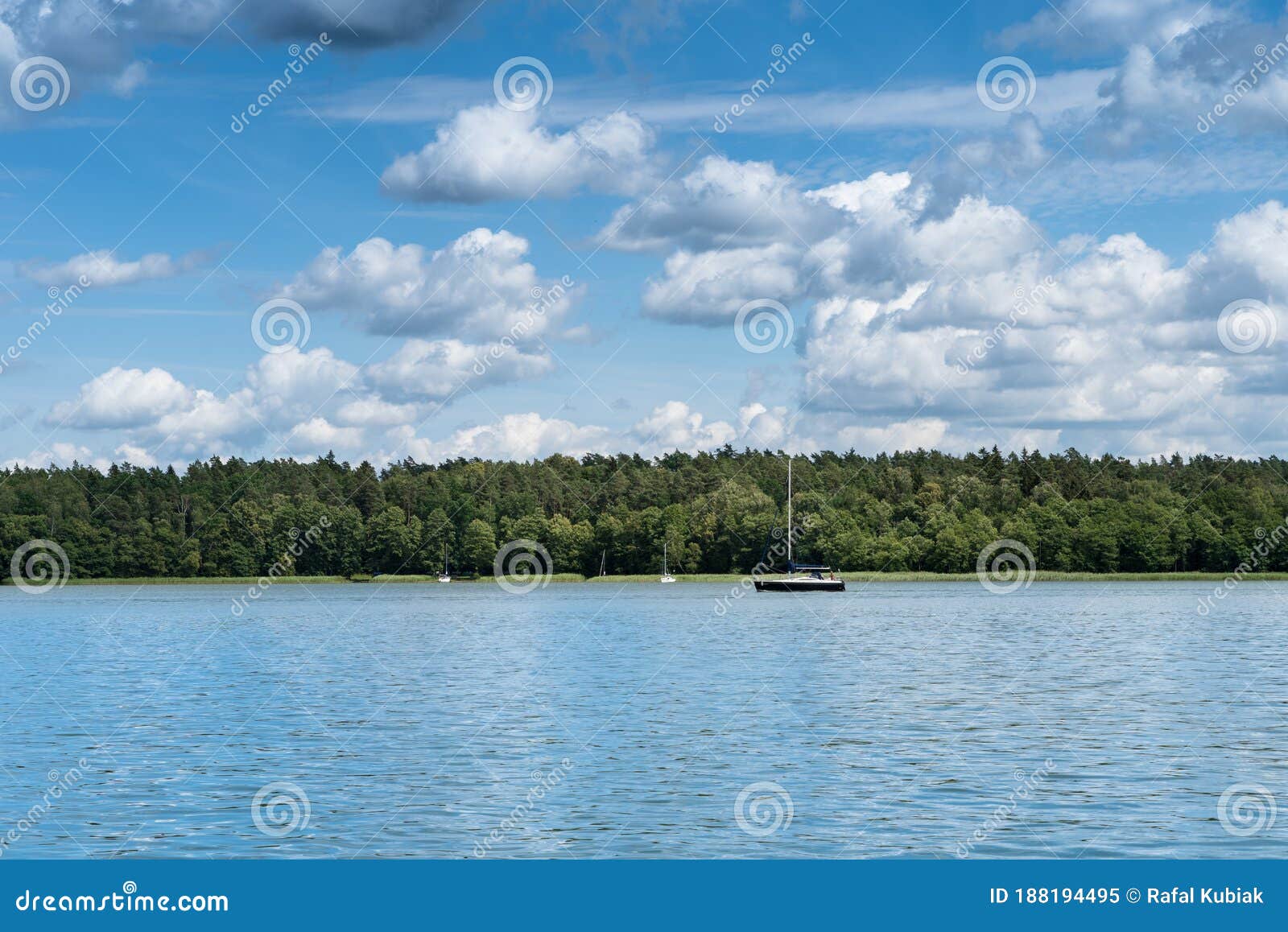 mazury lakes view with sailing boat at midday