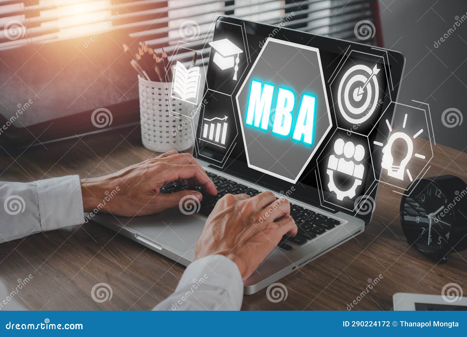 Business Person Working on Laptop Computer with MBA Icon on Virtual