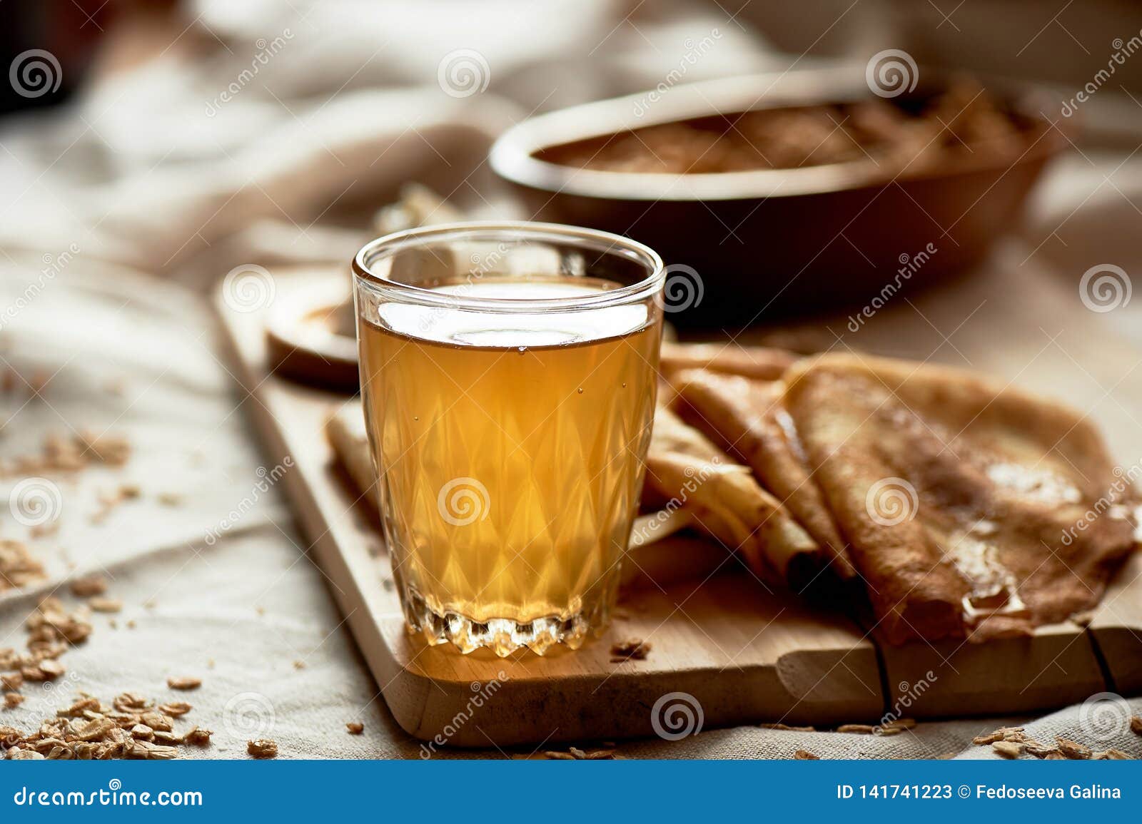 mead and pancakes. russian dish for shrove tuesday. farewell to winter, close a glass with a glowing drink.