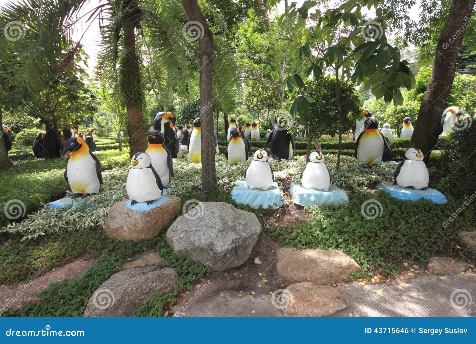 A Meadow With Penguins And Grass And Trees And Stones In The Nong