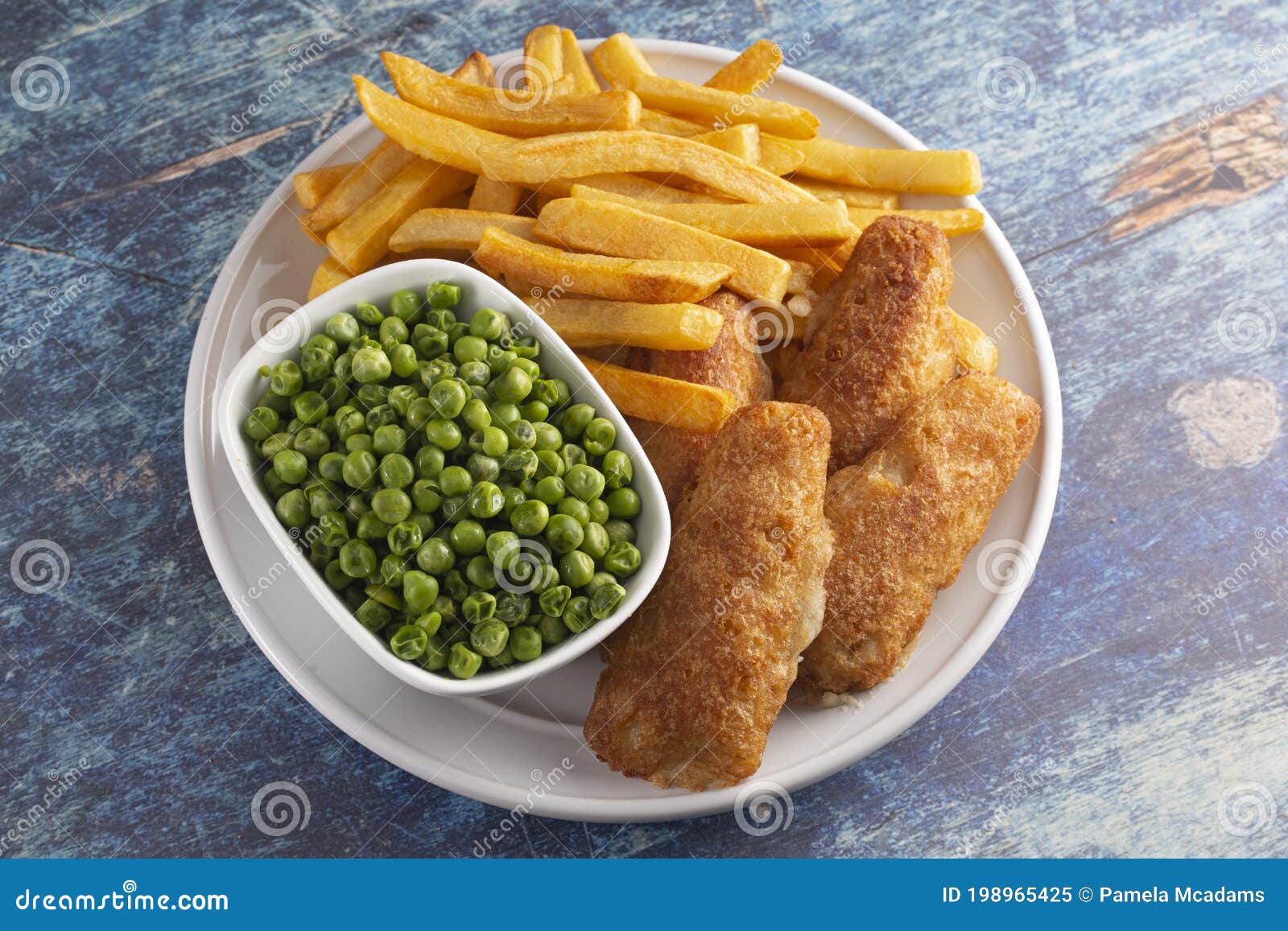 A Meal of Beer Battered Fish Chips and Peas Stock Image - Image of ...
