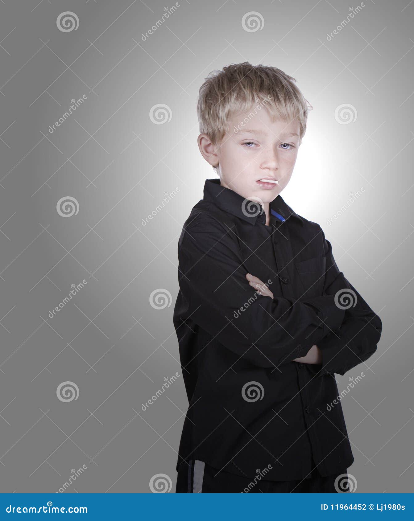 Mean and cool little boy stock photo. Image of blonde 11964452