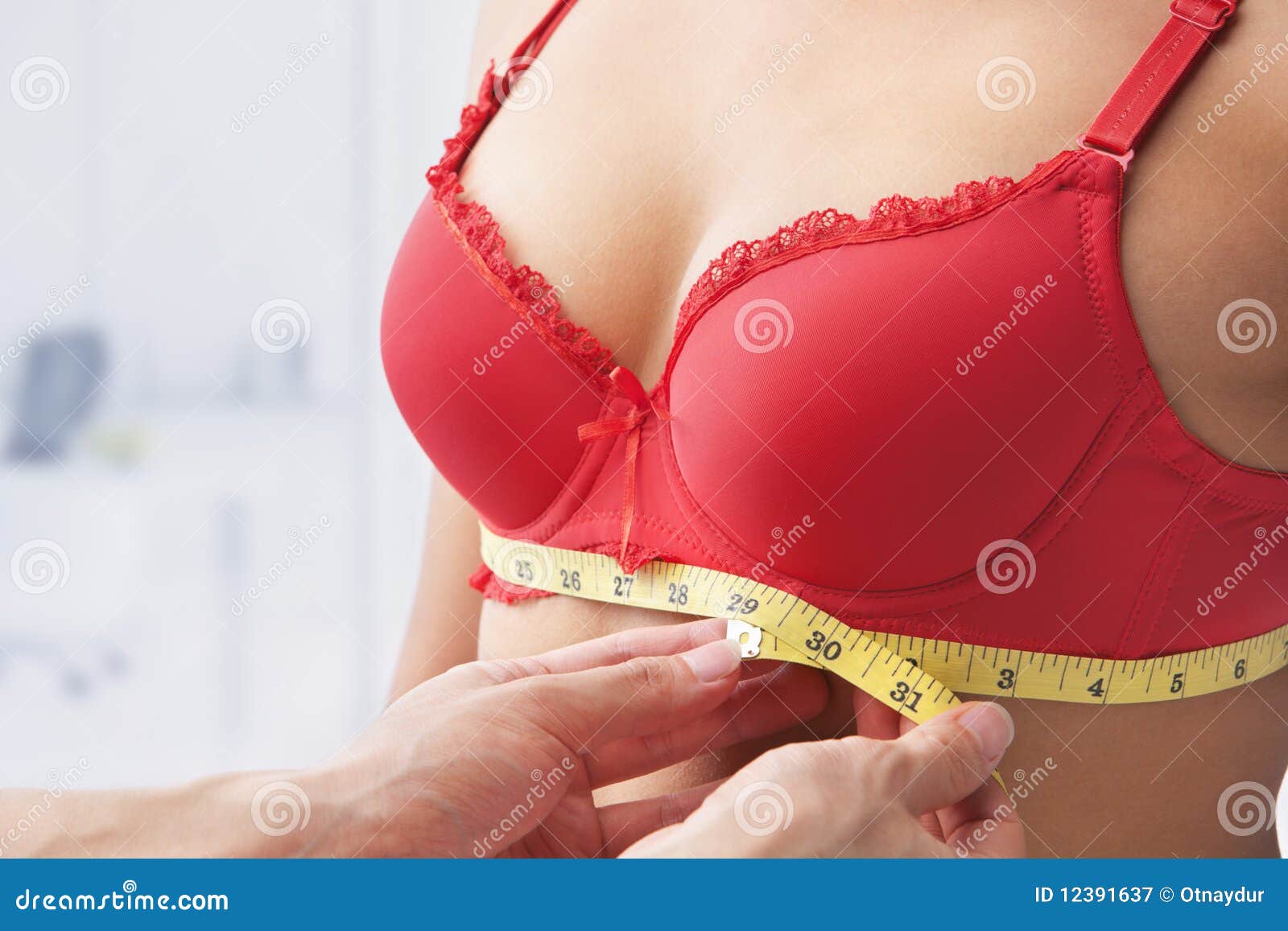 Bra, boobs and tape with woman measuring for weight loss, health and diet  for bust size. Plastic su Stock Photo by YuriArcursPeopleimages