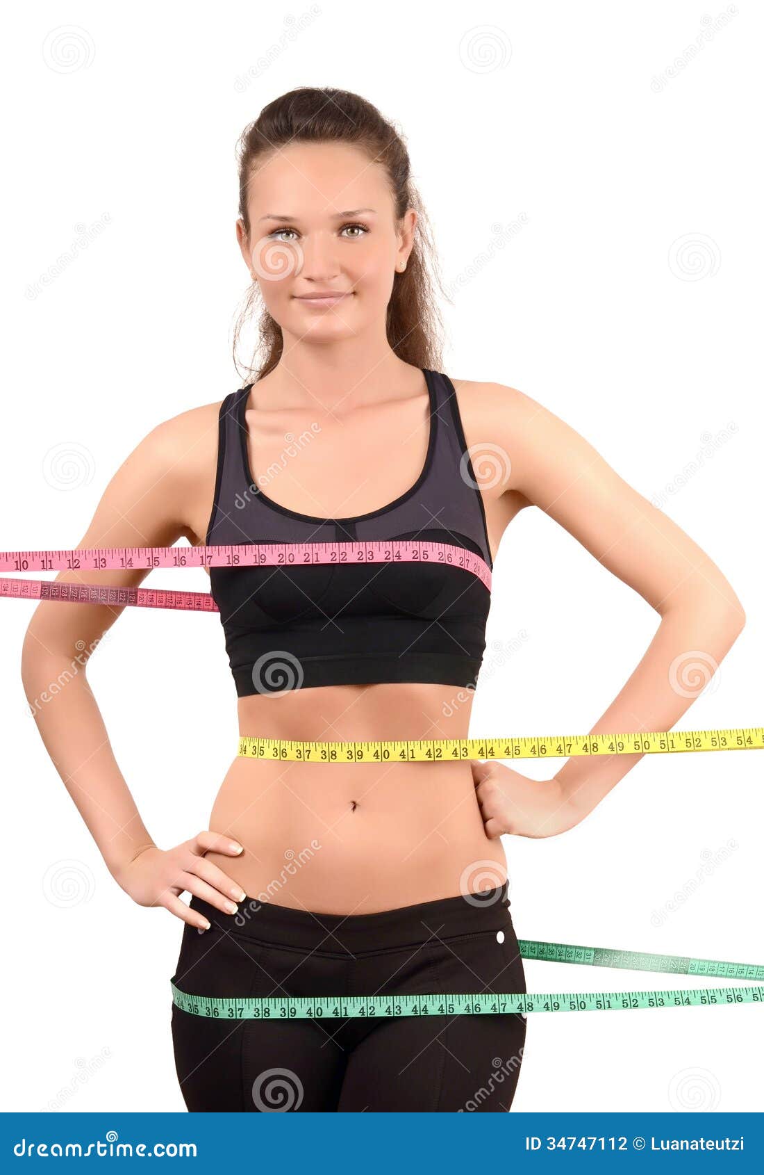 Girl Measures Her Waist Looking Down. Attractive Young Woman In Sports Bra  With Tape Measure On Background Of Sky Stock Photo, Picture and Royalty  Free Image. Image 38922572.