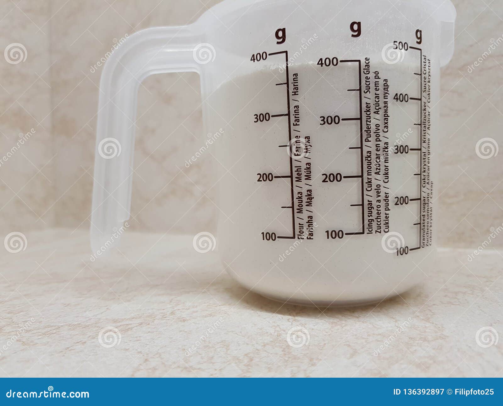 measuring cup with flour