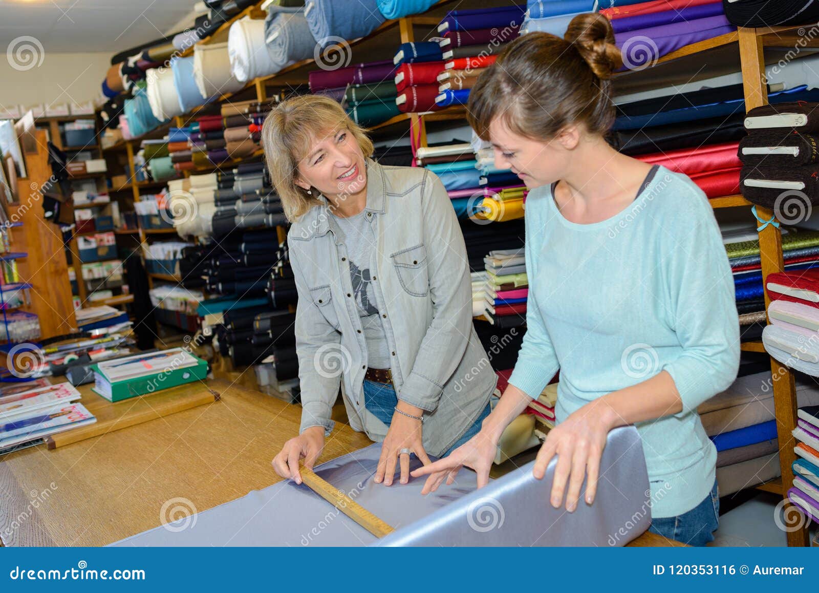Measuring an Expensive Silk Stock Photo Image of apprentice, fabric