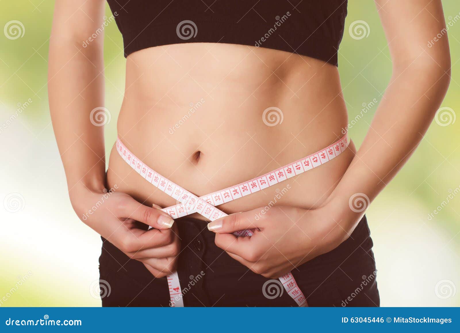 Fit woman measuring her waist. Weight loss concept. Royalty-Free Stock  Image - Storyblocks