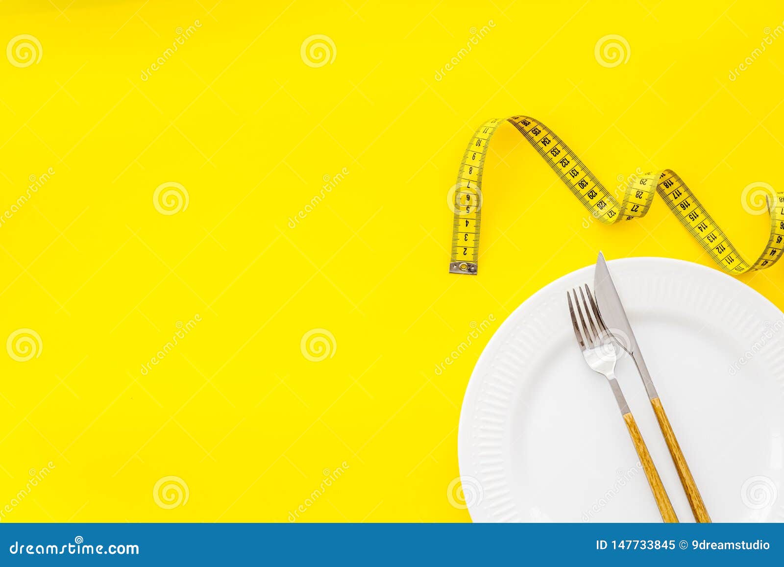 Download Measuring Tape Plate With Fork And Knife On Yellow Background Top View Mockup Stock Image Image Of Healthy Health 147733845