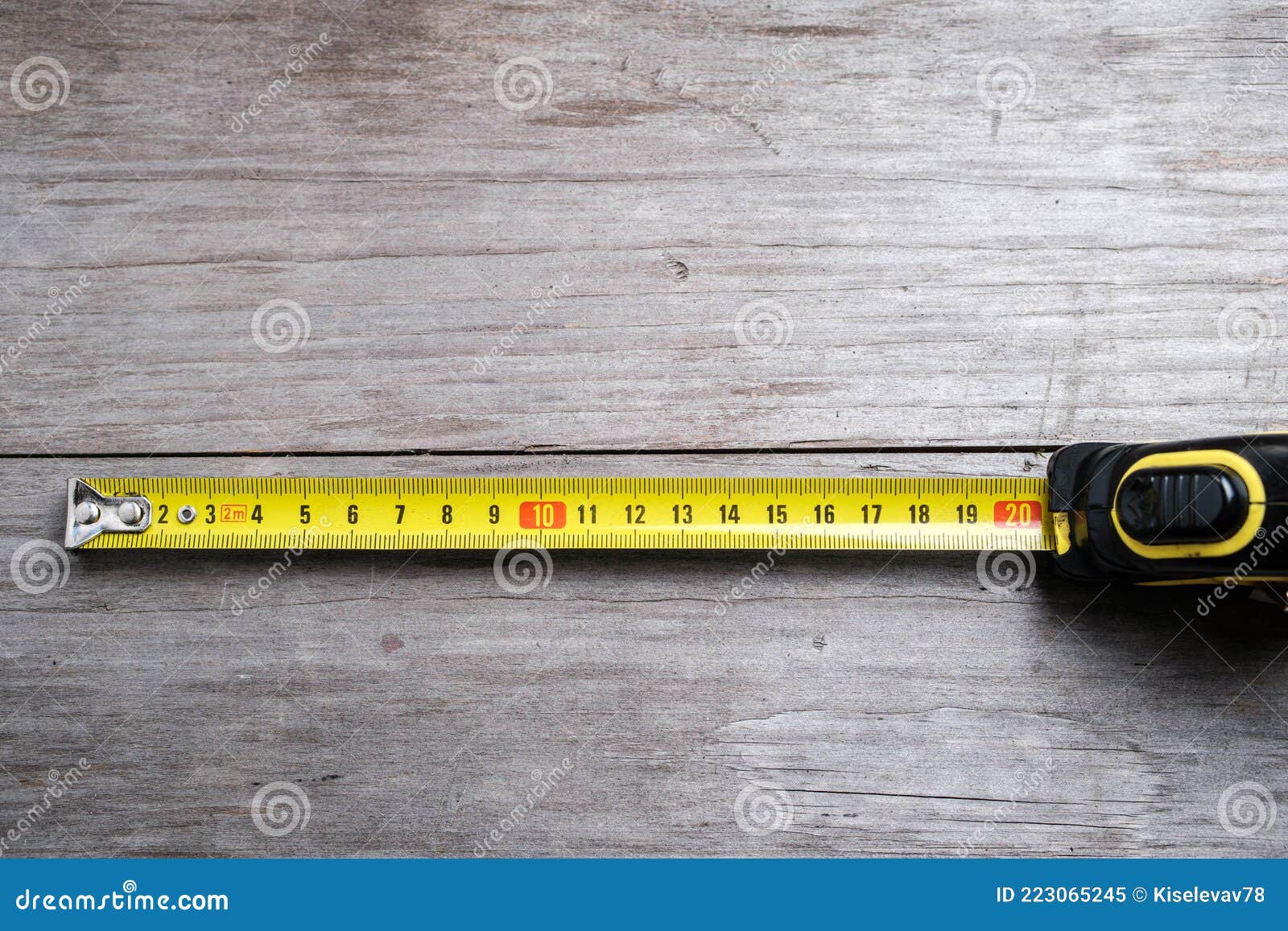 White Tailor Measuring Tape On A Wood Table Stock Photo - Download