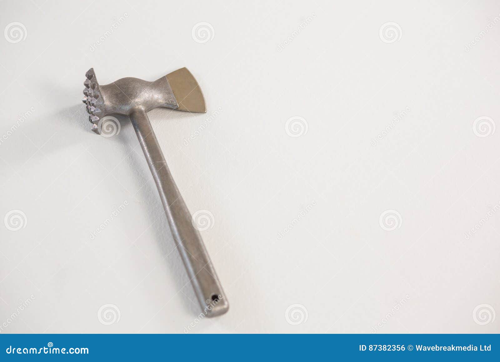 Meat cutting hammer against white background