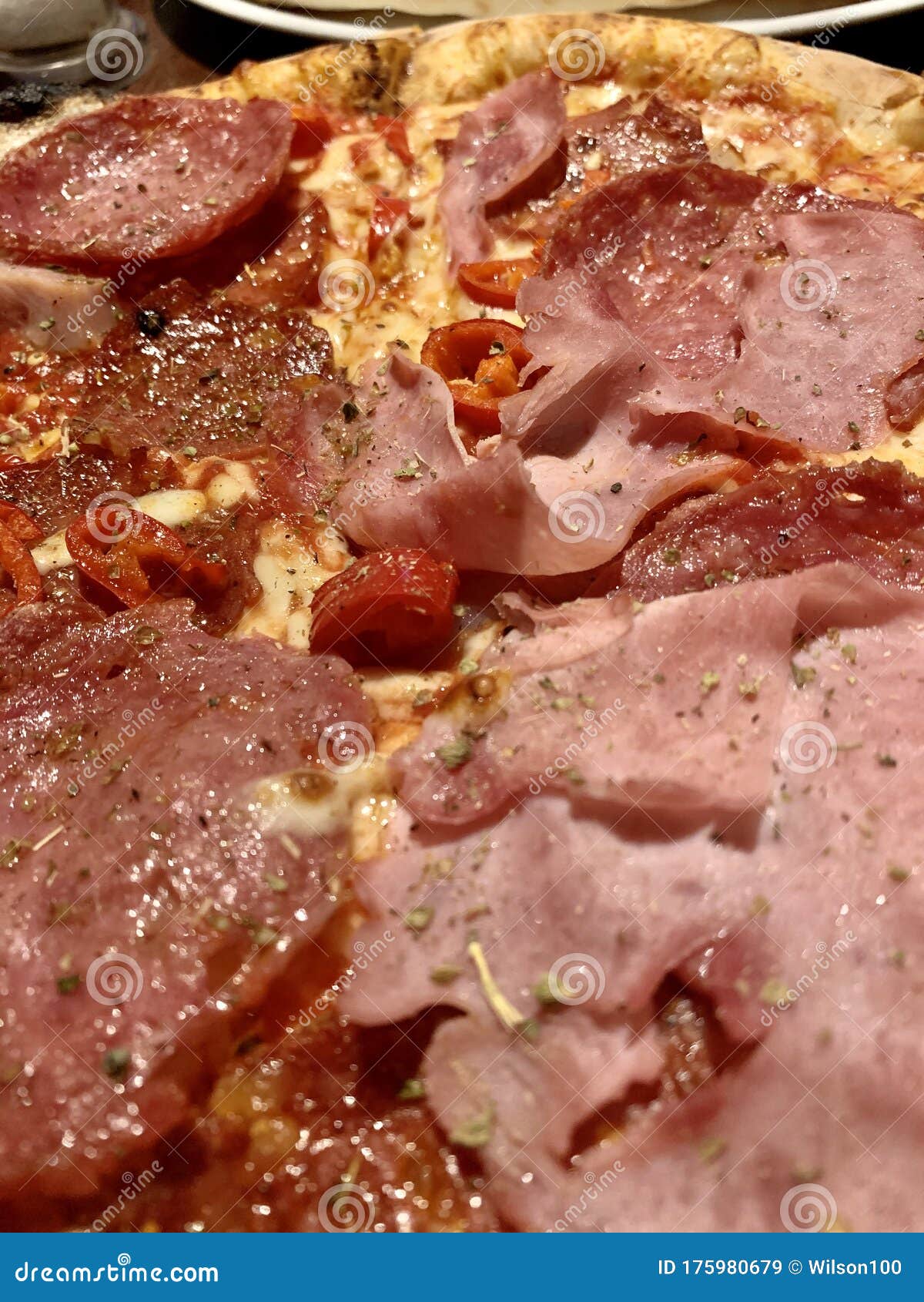 Meat Feast Pizza With Pepperoni And Spicy Sausage Topping Isolated On