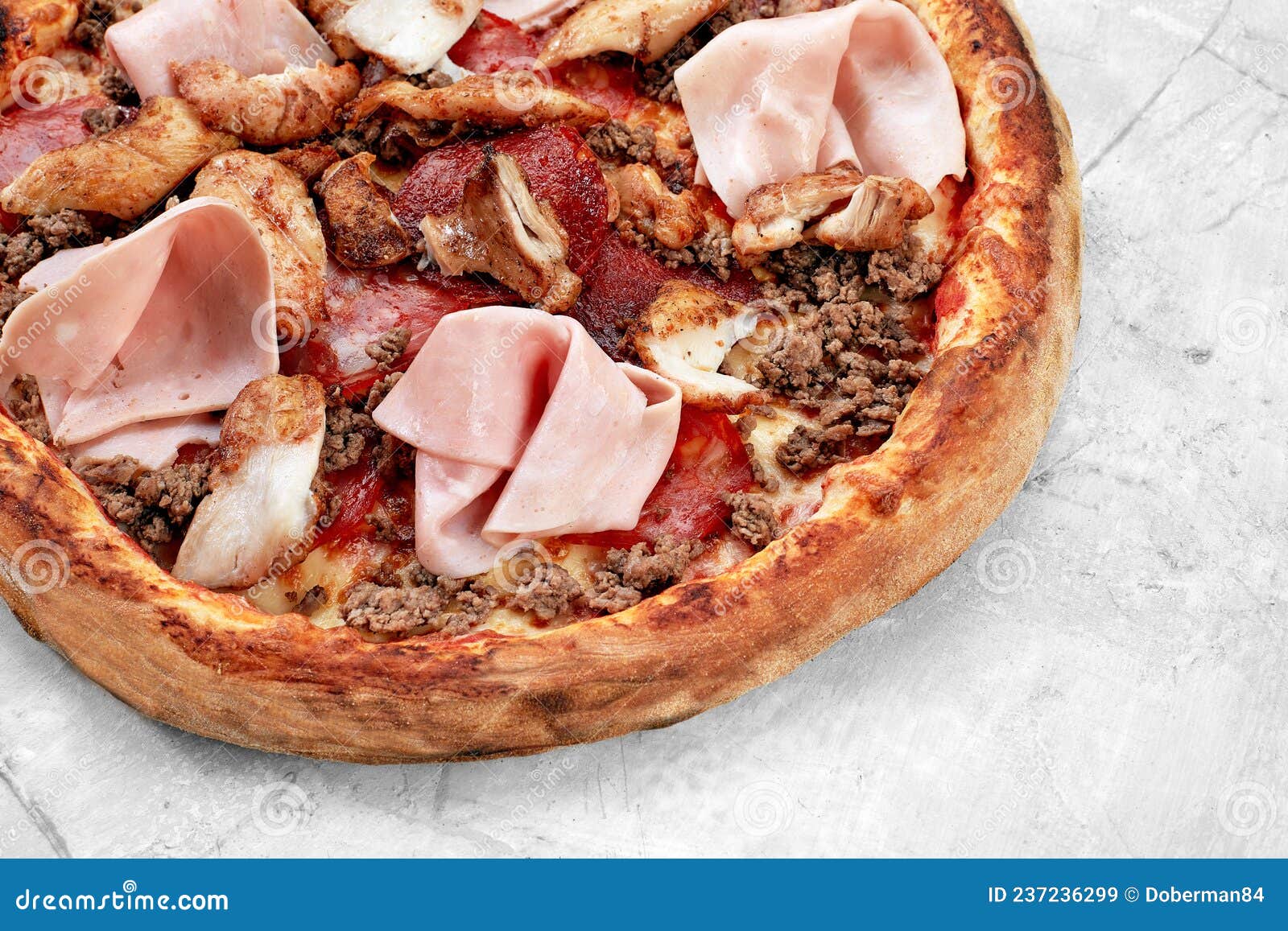 meat italian pizza with roast beef, steak slices, melted cheese, with olive slices and cheddar cheese. close up, macro