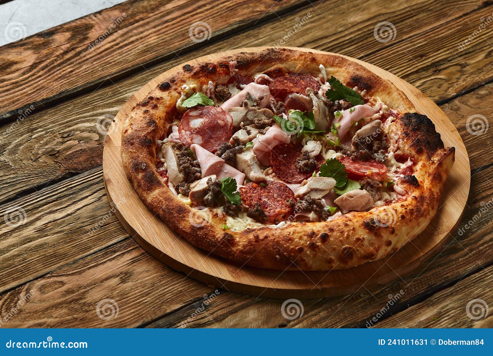 meat italian pizza with roast beef, steak slices, melted cheese, with olive slices and cheddar cheese. close up, macro
