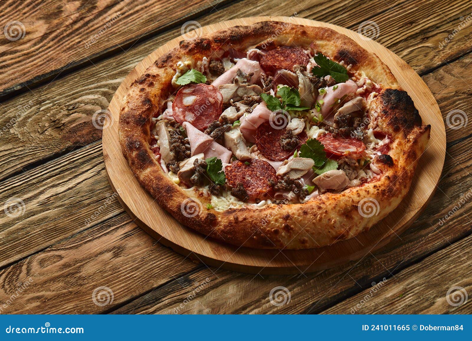 meat italian pizza with roast beef, steak slices, melted cheese, with olive slices and cheddar cheese. close up, macro