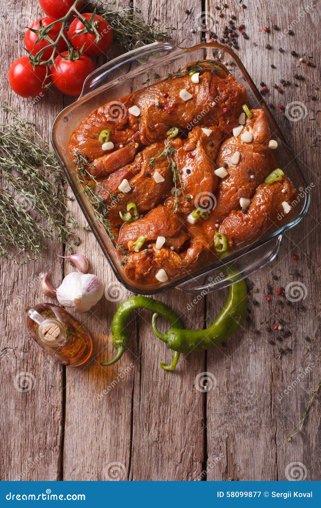 Meat in Red Marinade with Spices in a Bowl. Vertical Top View Stock