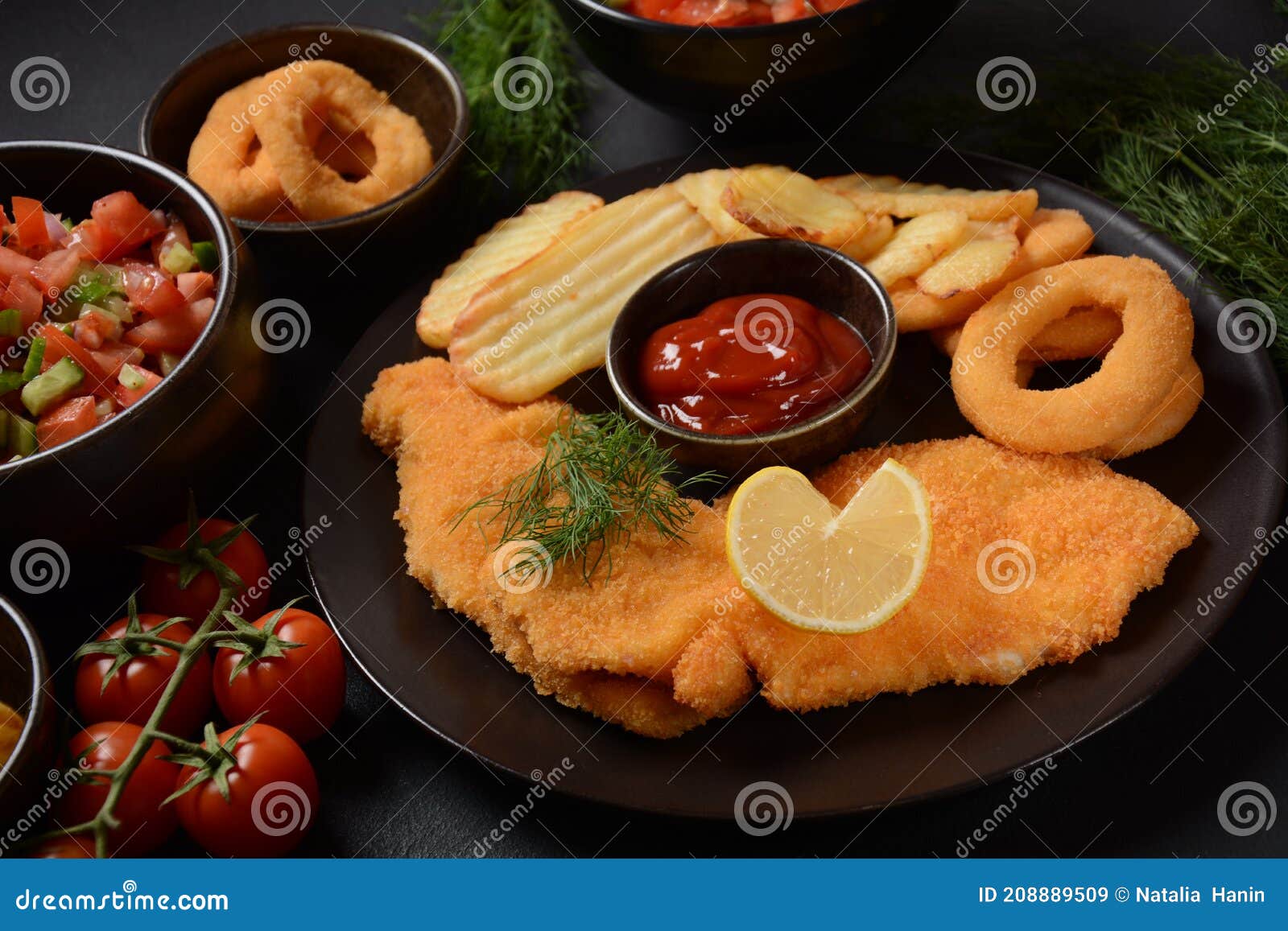 Meat Schnitzel and Fried Potatoes with Onion Rings Deep Fried Stock Image Image of crumbs