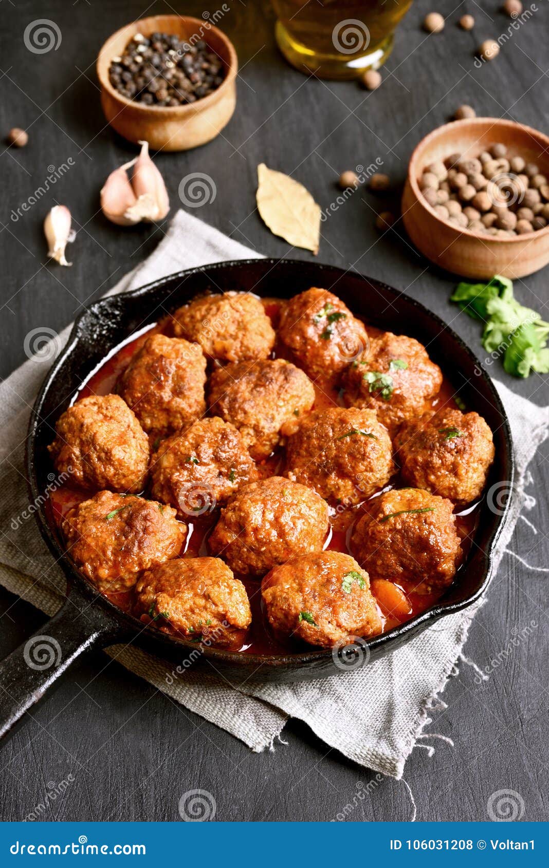 Meatballs in cast iron pan stock photo. Image of herbs 106031208