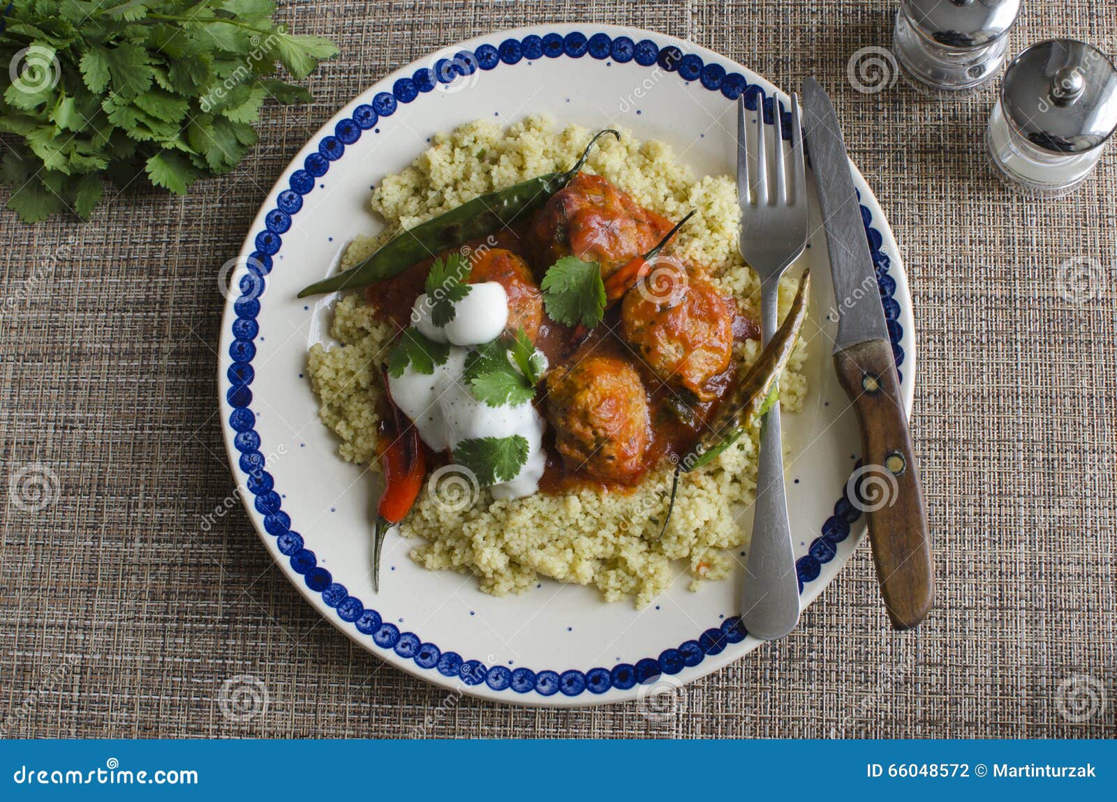 Meatballs with couscous stock photo. Image of peppers 66048572