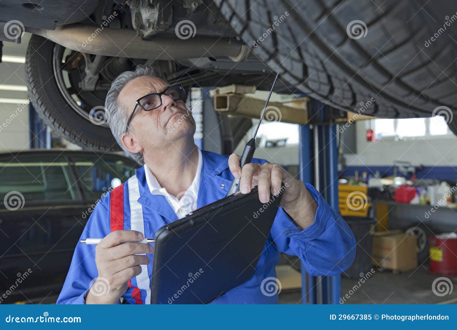 Mechanic Analyzing Car Engine at Auto Repair Shop Stock Image Image