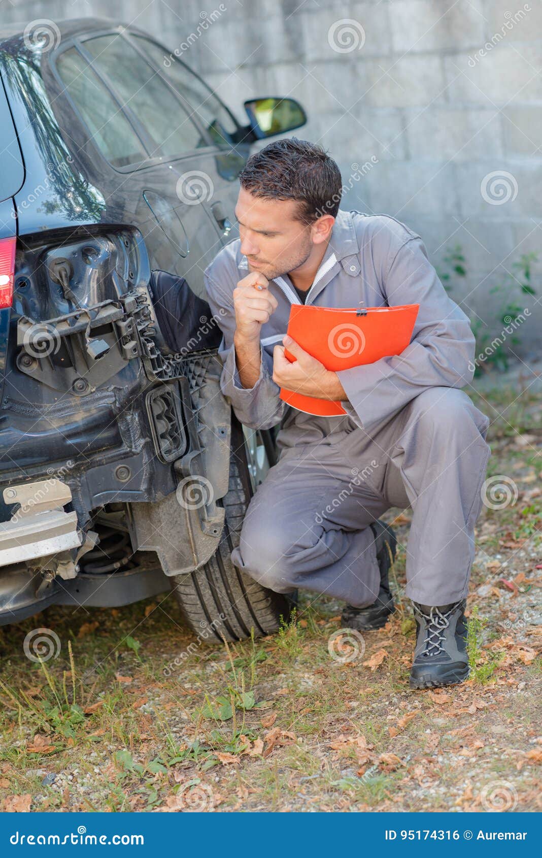 Mechanic Assessing Damage To Rear Car Stock Photo Image of accident, assessor 95174316