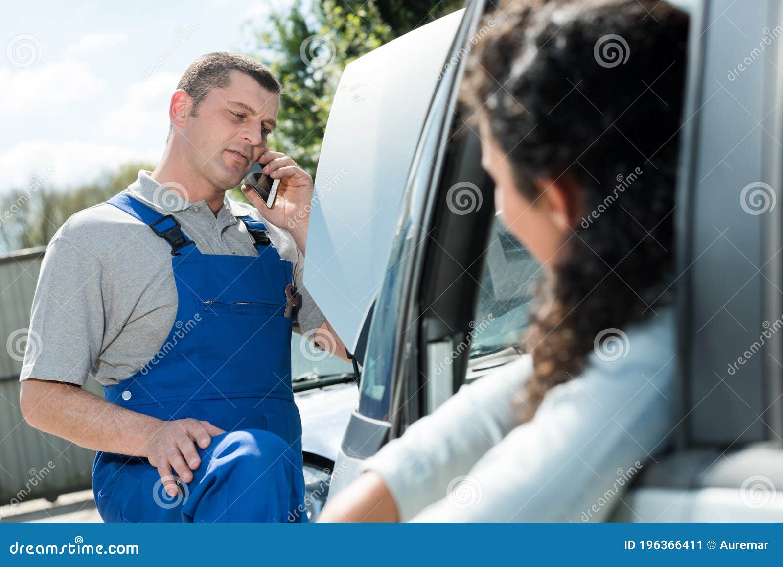 Mechanic attending to call stock image. Image of assistance 196366411