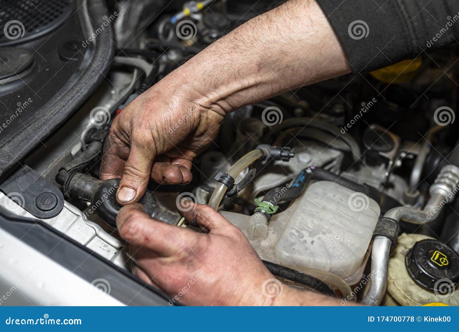 The Mechanic Bleeds the Fuel System with a Pump that is on the Fuel