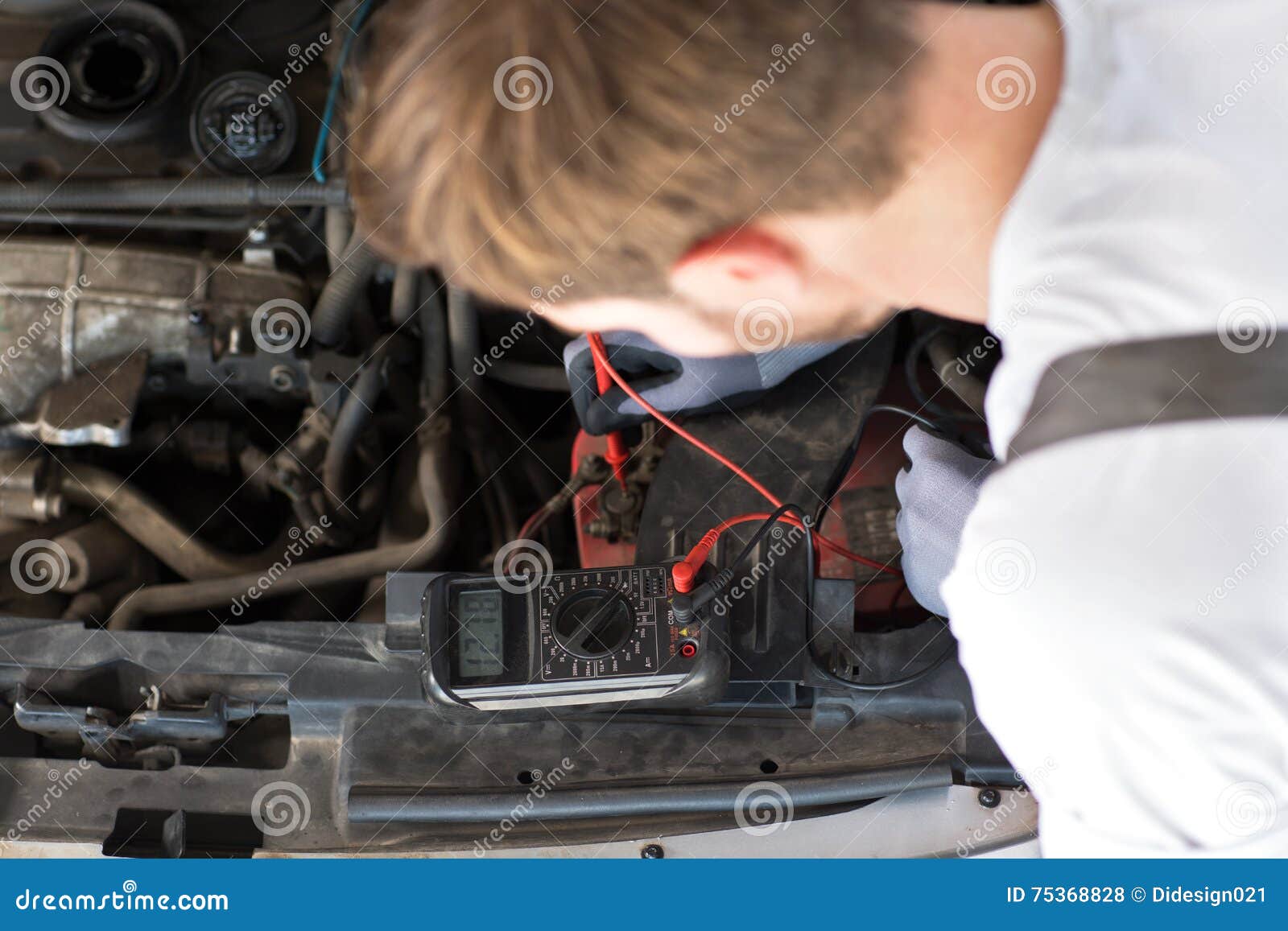 mechanic checks electronics accumulator