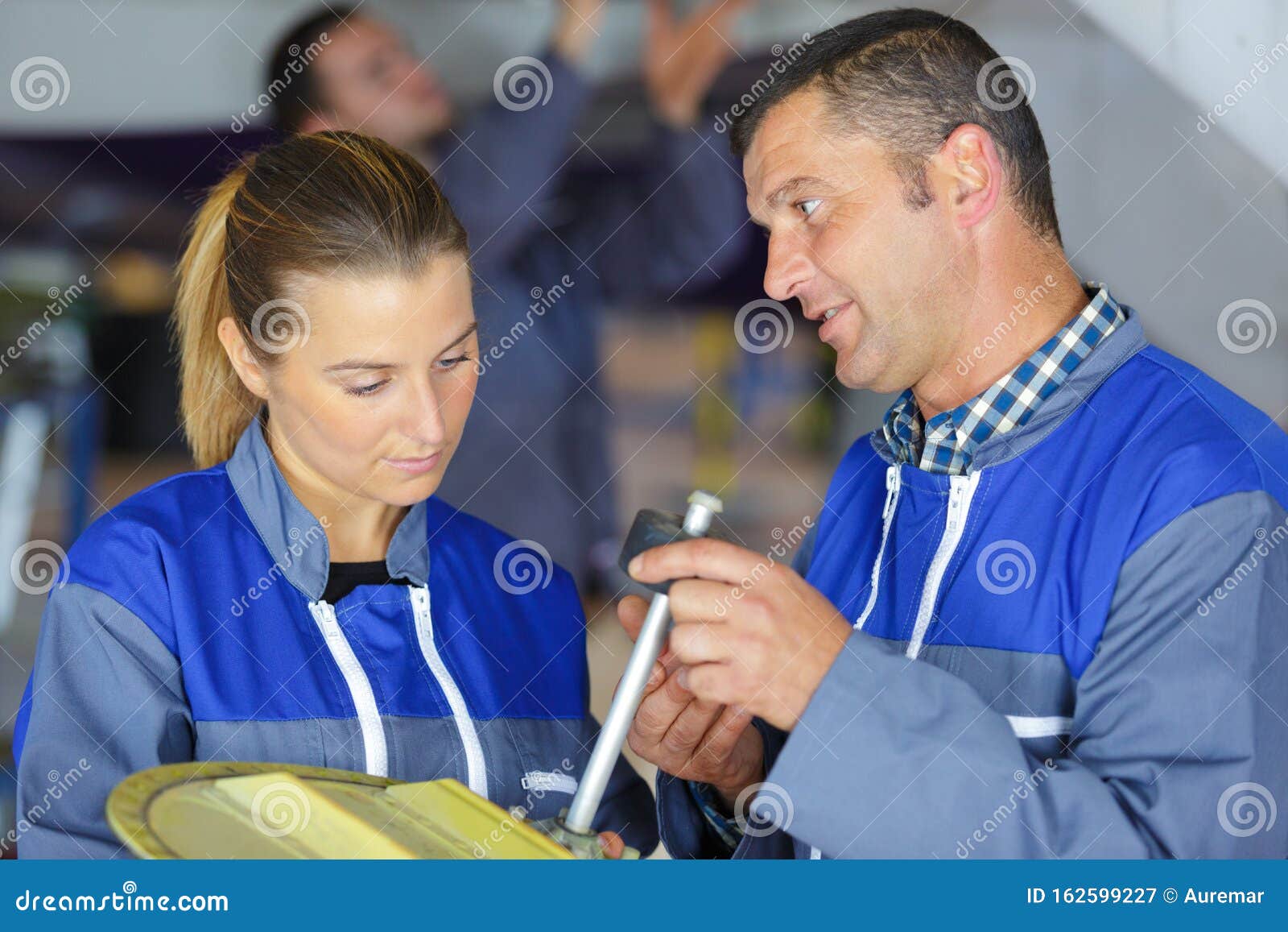Mechanic and Female Trainee Working Together Stock Image Image of