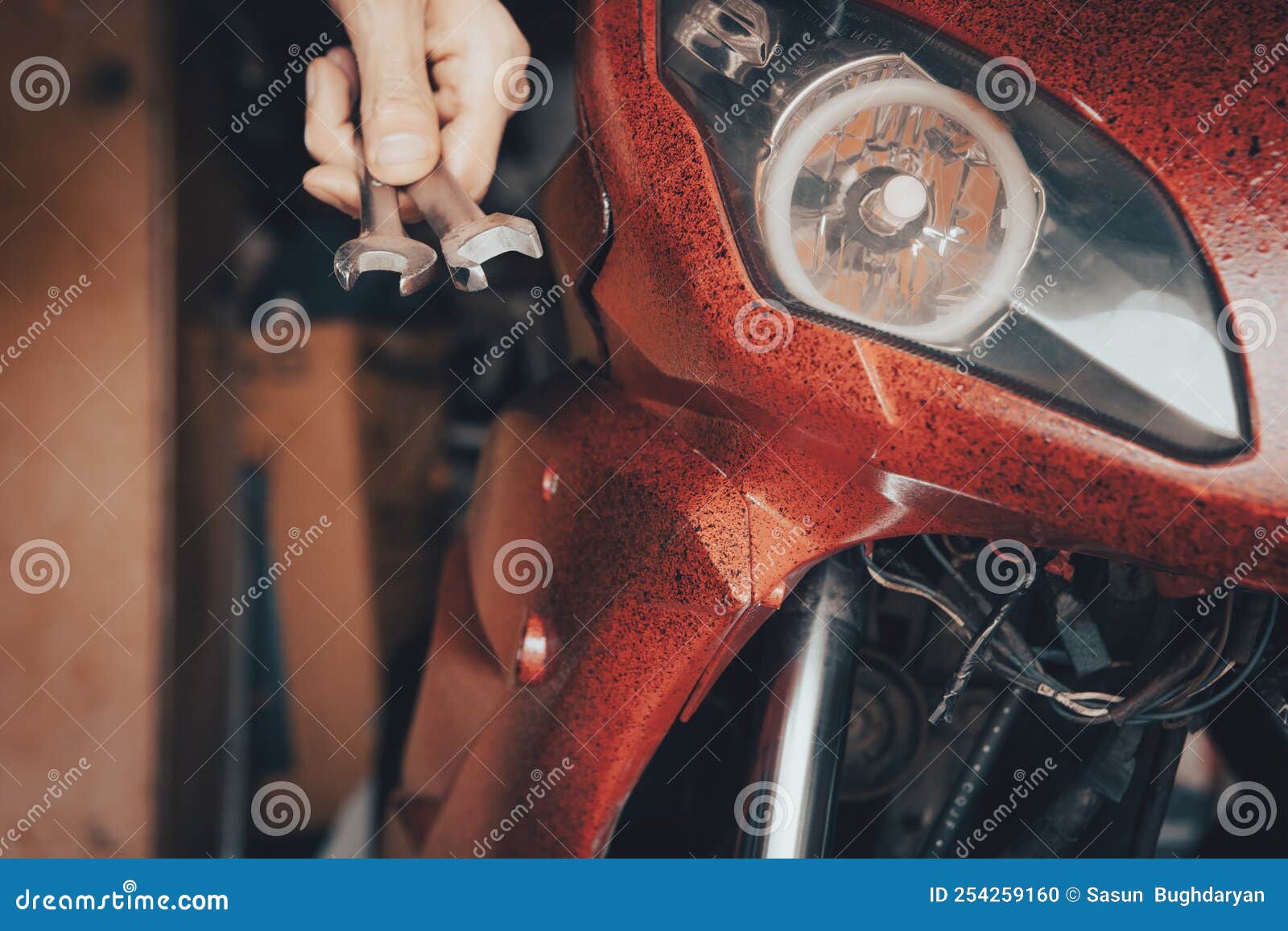 Mechanic Fixing a Motorcycle in the Garage Stock Photo Image of