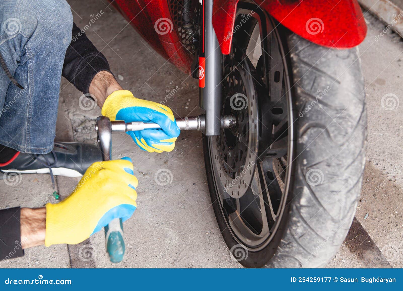 Mechanic Fixing a Motorcycle in the Garage Stock Image Image of
