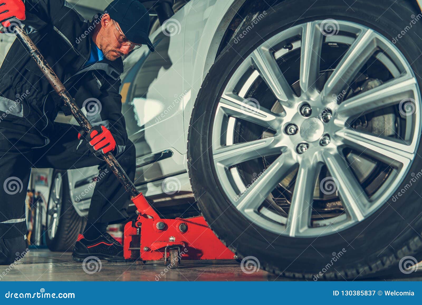 Mechanic With Floor Jack Lift Stock Image Image Of Lift Work