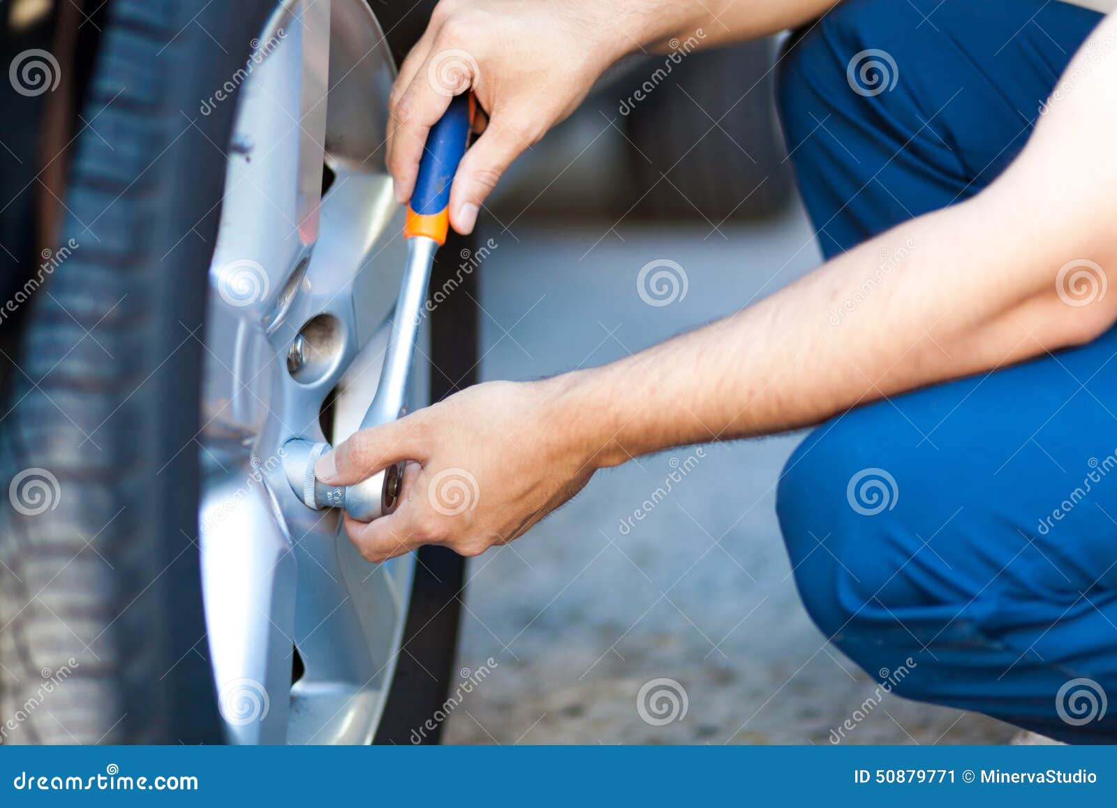 Mechanic in His Changing Tires or Rims Stock Image Image of