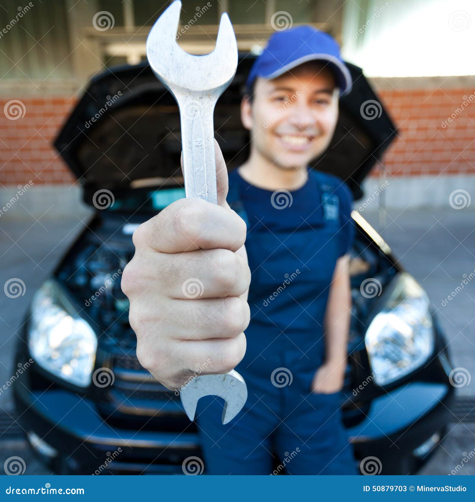 Mechanic Holding a Wrench at a Car Garage Stock Image Image of person