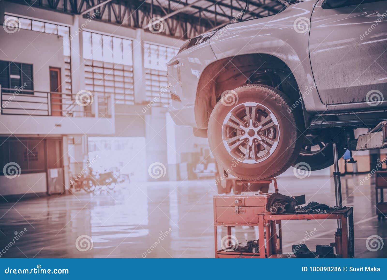 Mechanic Inspect Car Suspension System and Chassis Under the Car Stock
