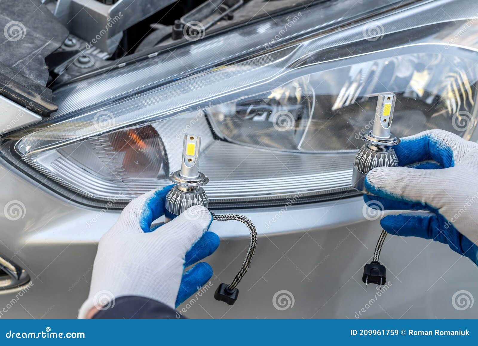 Mechanic Installing Changing Modern Halogen Headlight Bulb Stock Image