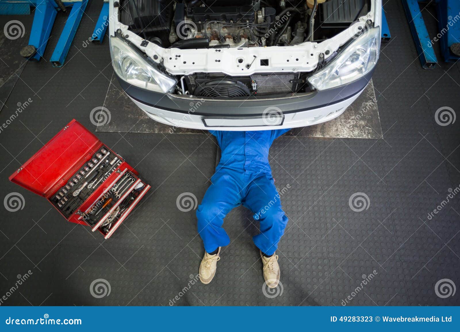 Mechanic Lying And Working Under Car Stock Image Image