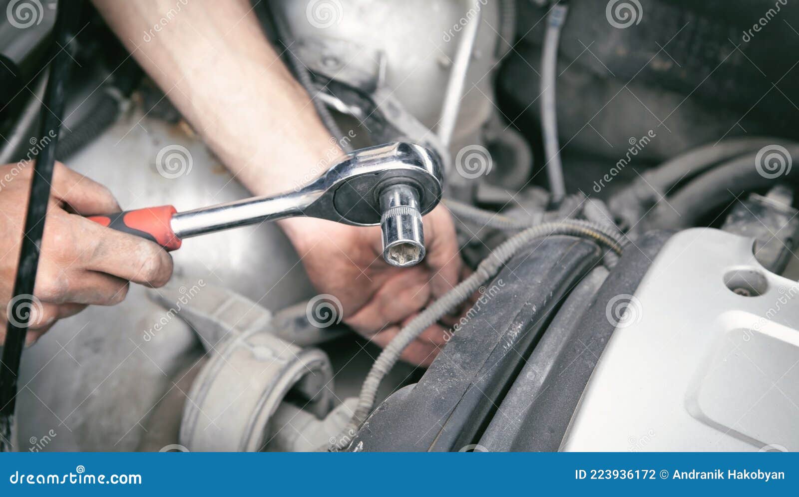 Mechanic Repairing Car with Ratchet Wrench Stock Photo - Image of ...