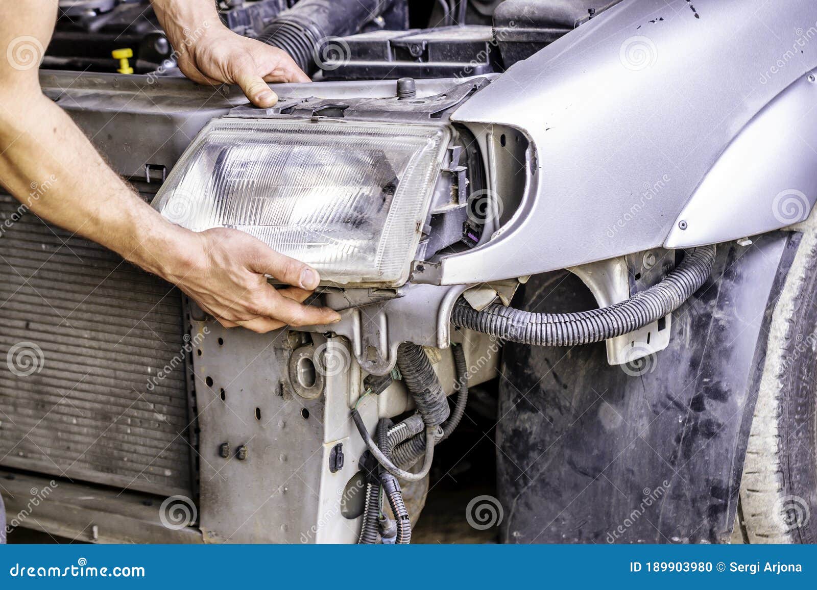 Mechanic Repairing the Headlight Stock Photo Image of mechanic