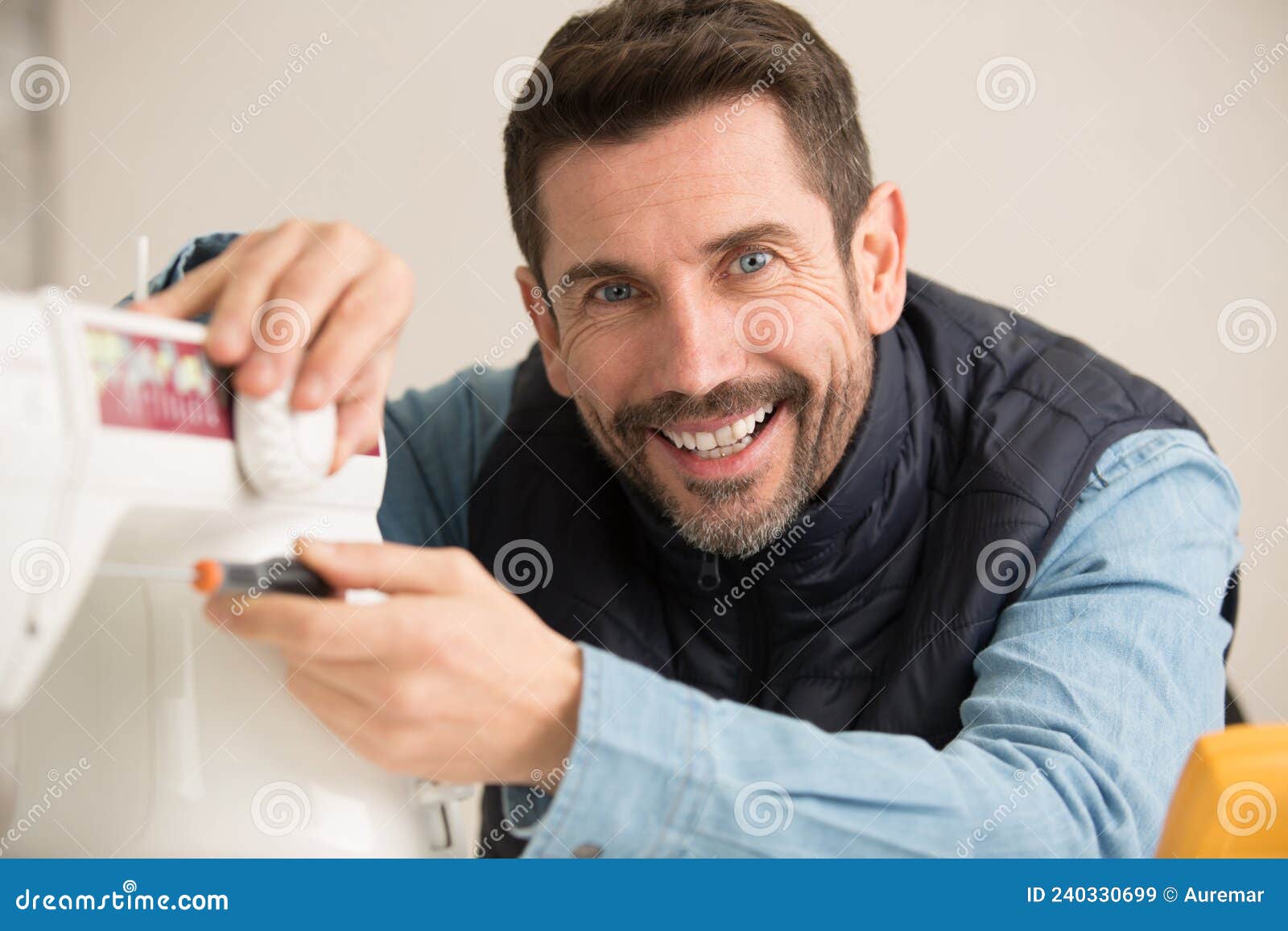Mechanic Repairing Sewing Machine with Screwdriver Stock Image Image