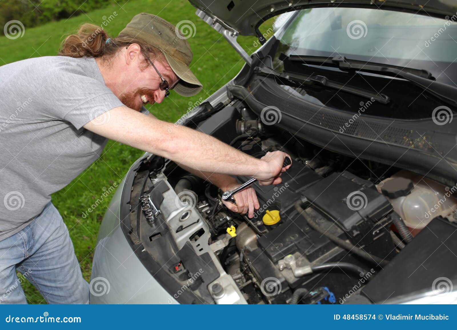 Mechanic repairs a car stock photo. Image of maintain 48458574