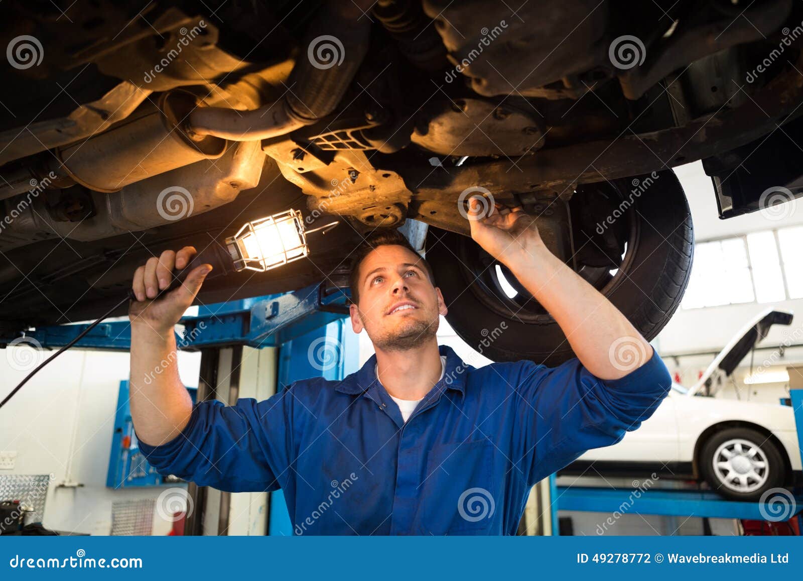 Mechanic Shining Torch Under Car Stock Photo Image Of Mechanic Torch