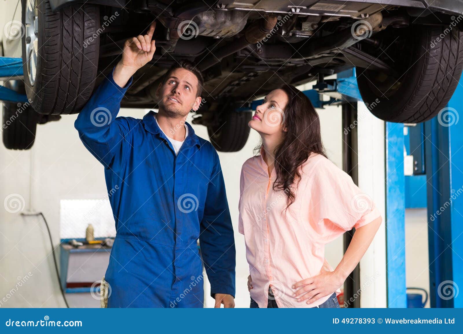 Mechanic Showing Customer the Problem with Car Stock Image Image of