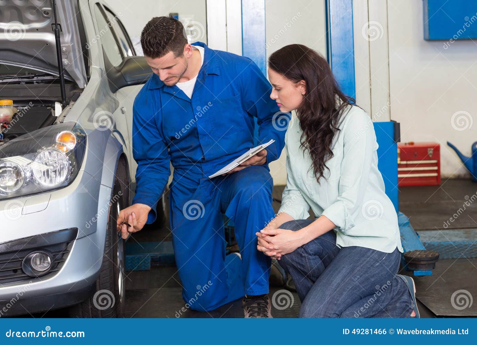 Mechanic Showing Customer the Problem with Car Stock Photo Image of