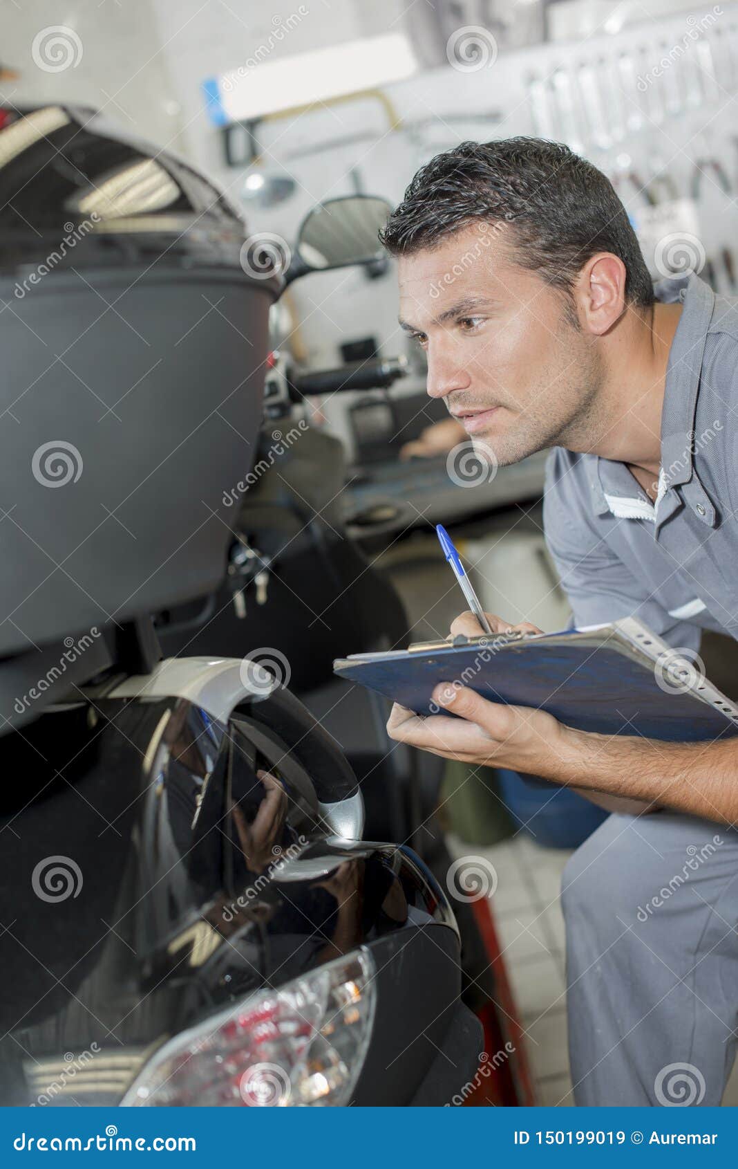 Mechanic testing a car stock image. Image of station 150199019