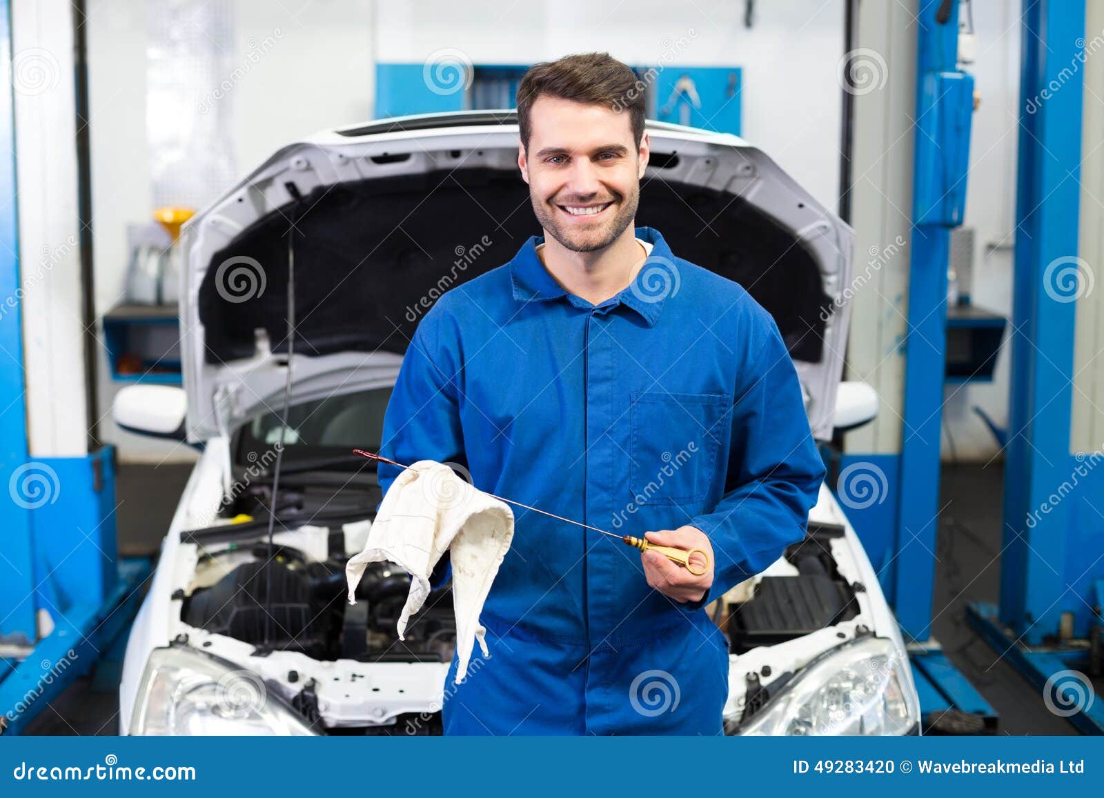 Mechanic Testing Oil in Car Stock Photo Image of engineer, garage